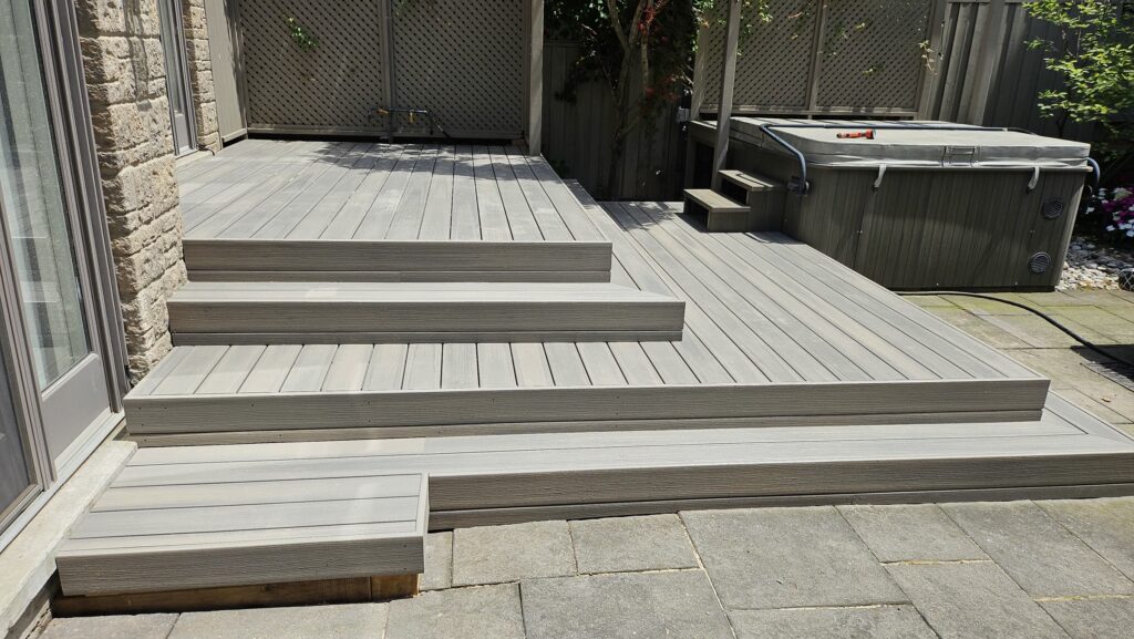 Completed composite deck replacement with black aluminum railings